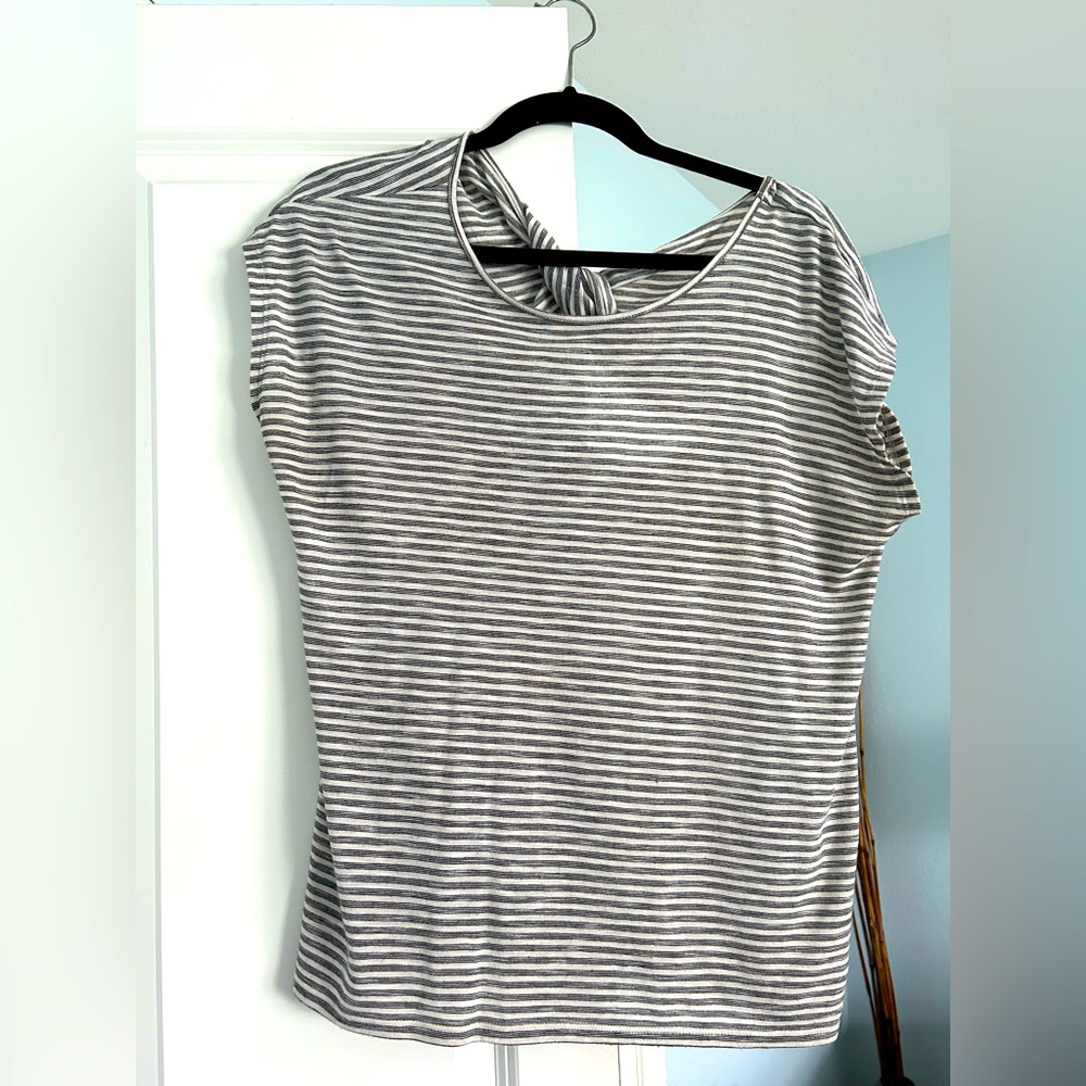 LOFT top with peek a boo cutout in back with a twist!